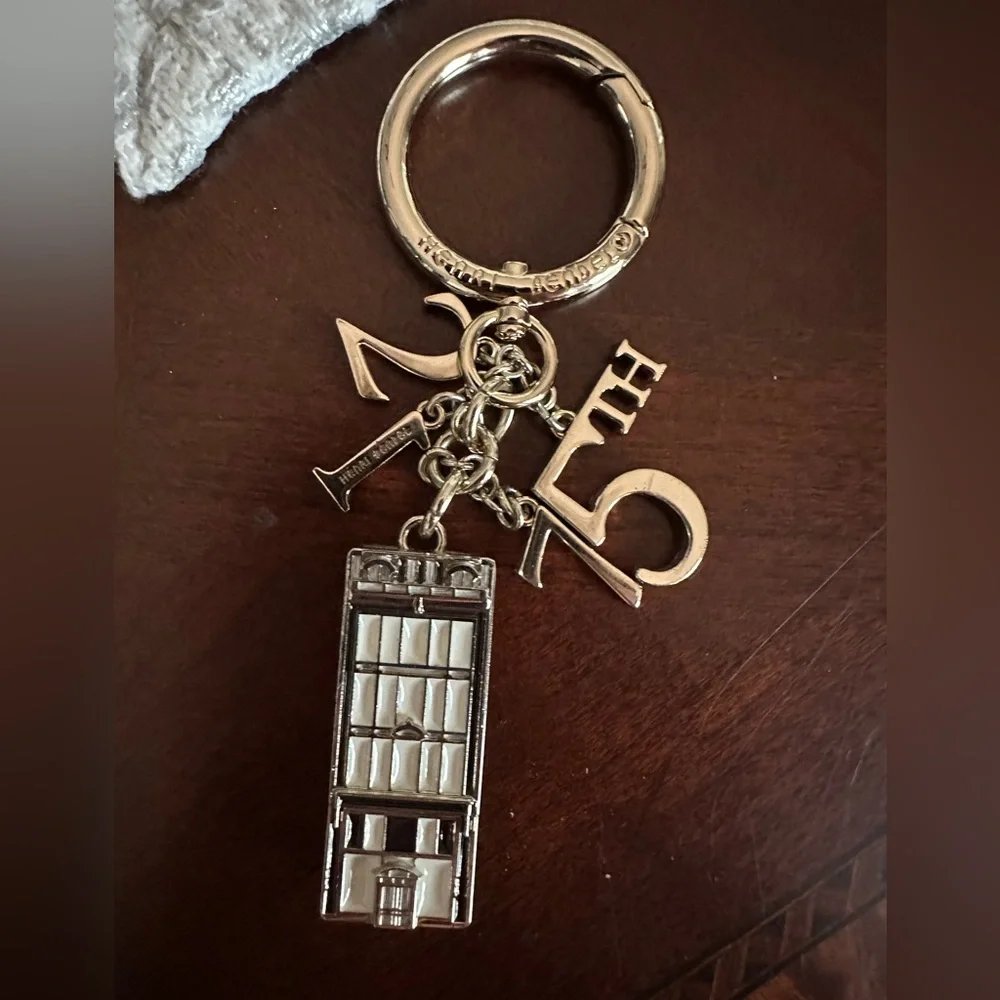 Gorgeous Henri Bendel Iconic 712  5th Avenue Gold Keychain Fob Bag Charm VGUC